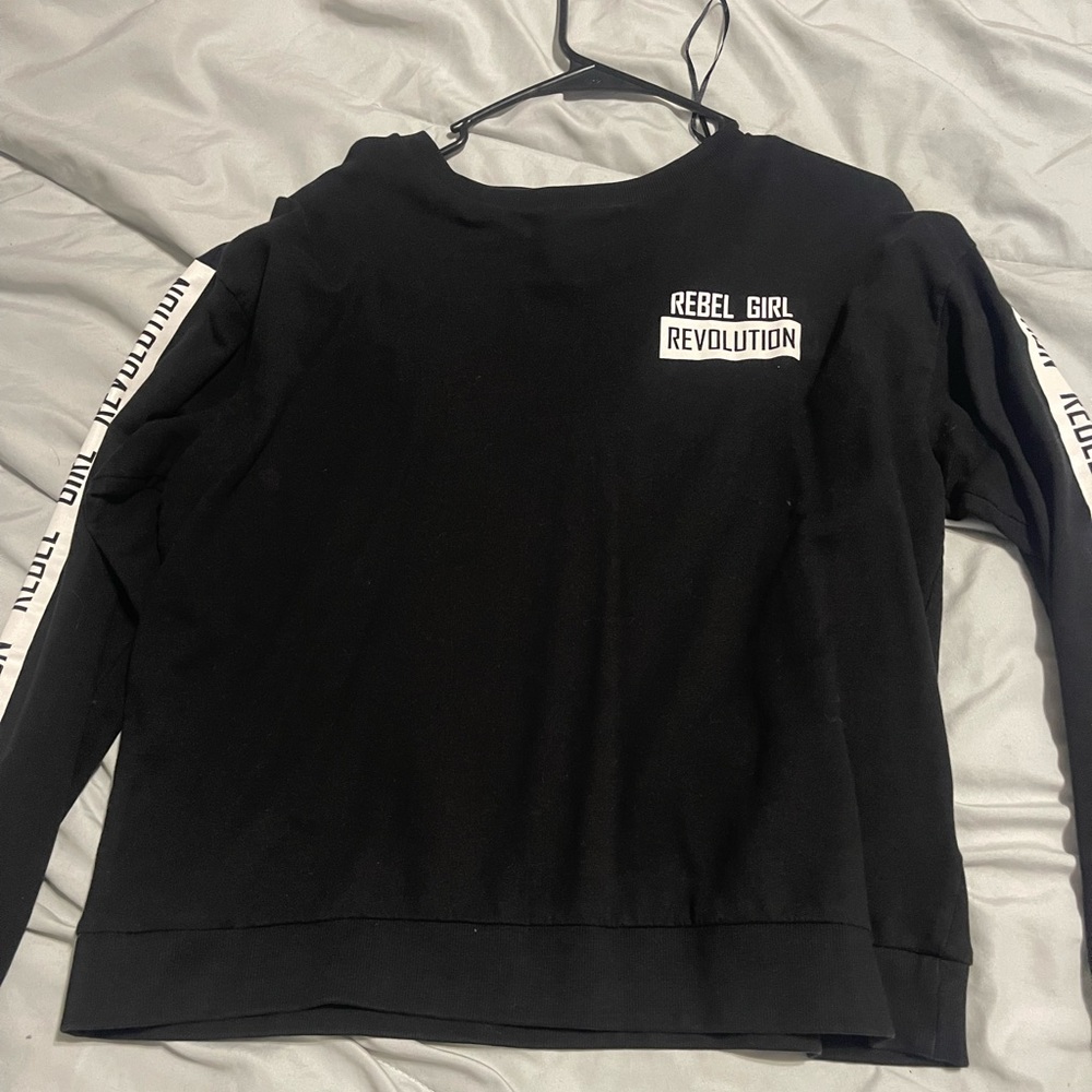 Long sleeve shirt. Side of arms says rebel girl revolution. Size large.